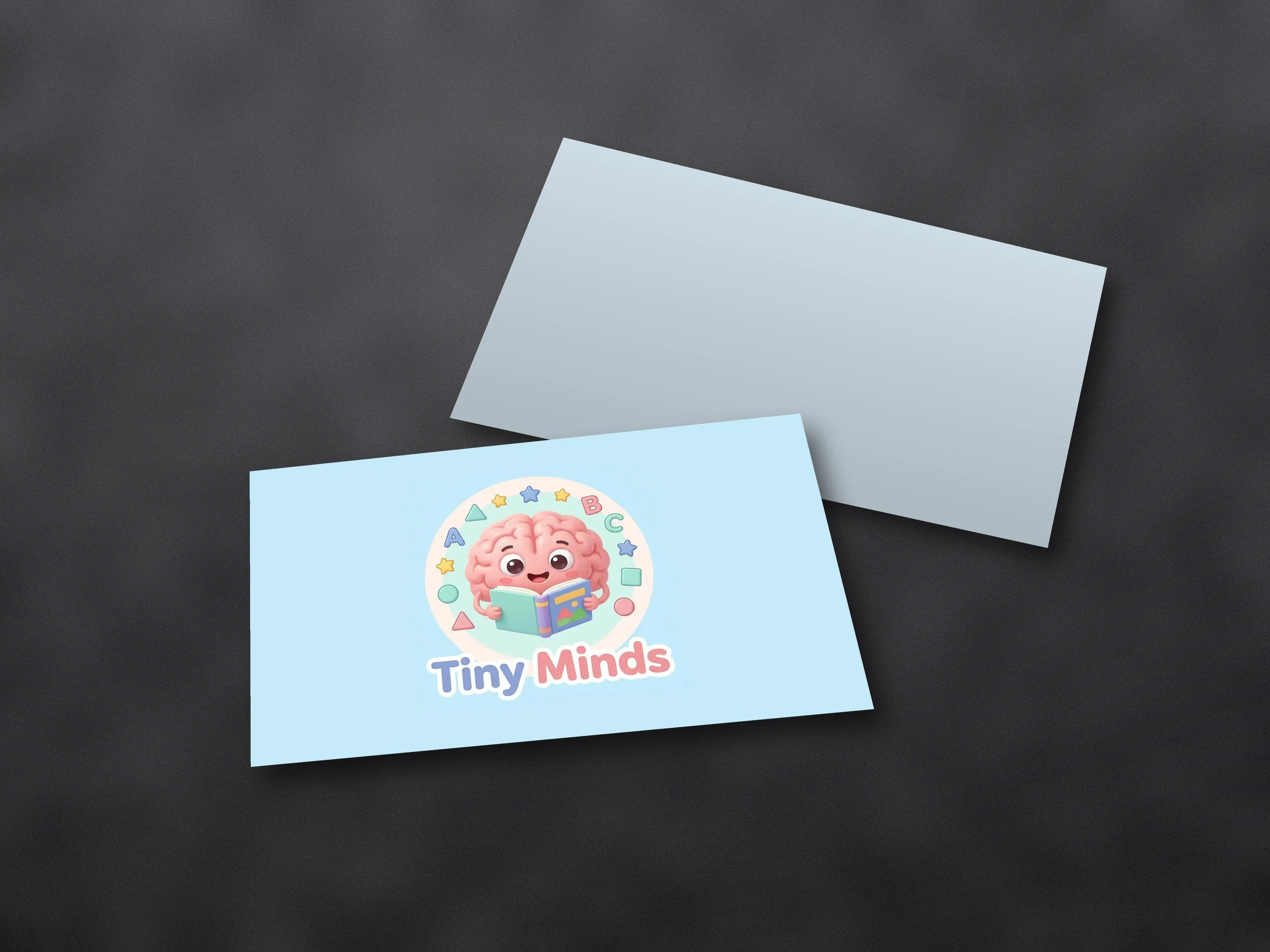 Friendly brain mascot reading a book inside a ring of letters and shapes, shown as a mockup